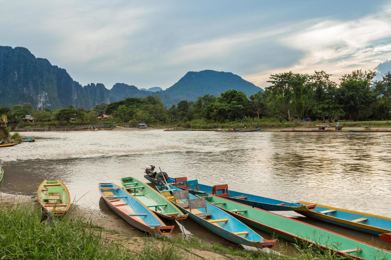 Boats in Nam Song river at Vang Vieng, Laos 19884570 Stock Photo at ... What Is The Role Of An Insurance Broker In Policy Selection
